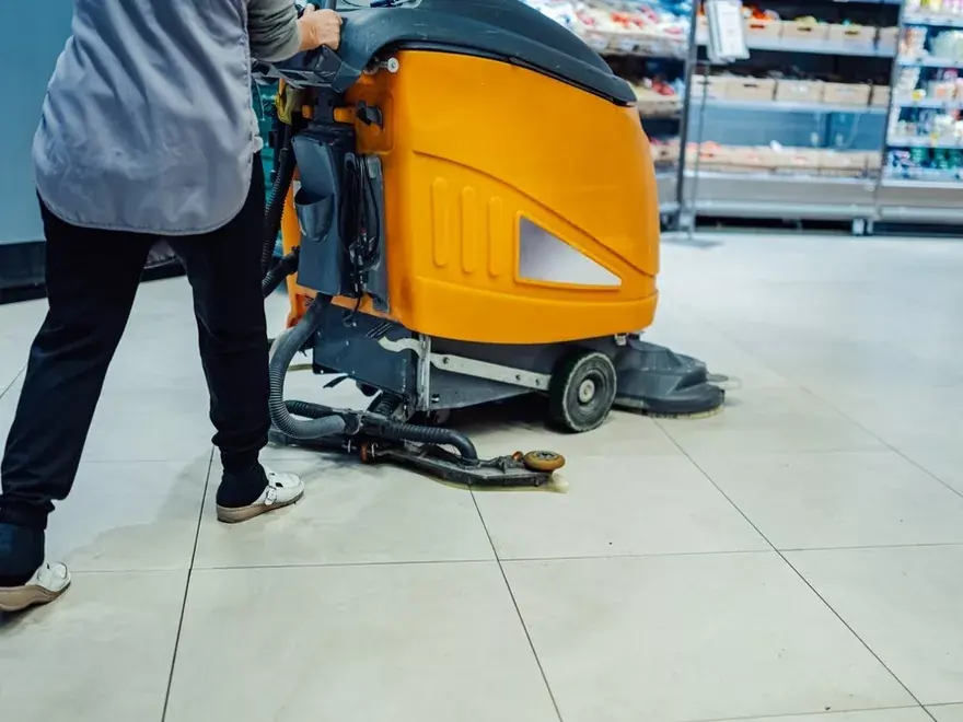 Professional floor-cleaning machine operating in a retail store